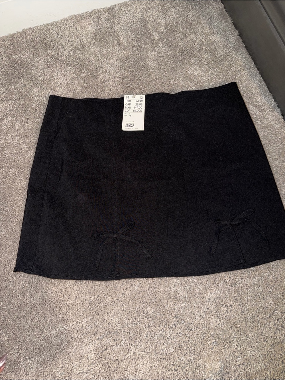 Divided Black Mini Skirt with Dual Bow Accents